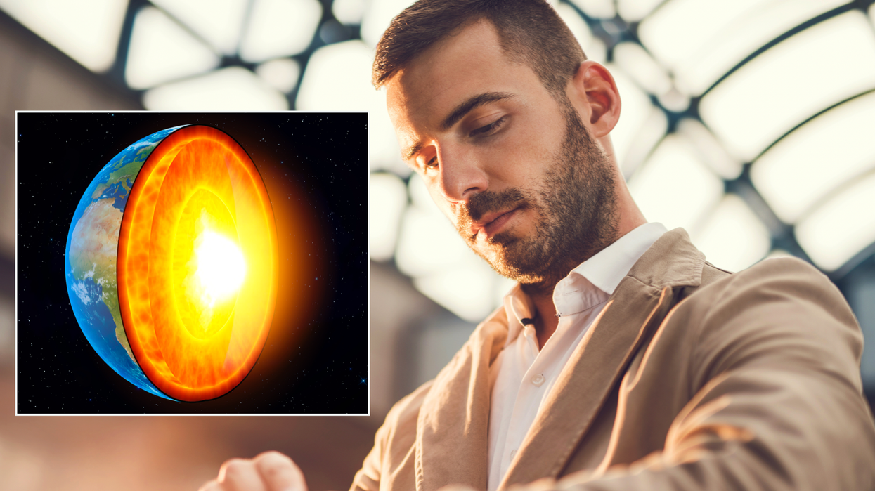 Composite image of the earth's inner core and a man looking at his watch