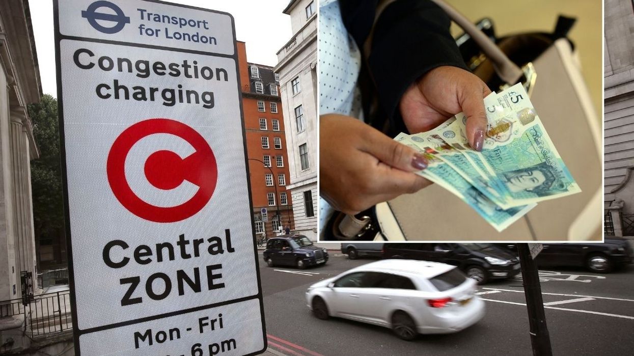 Congestion Charge sign and a person holding money