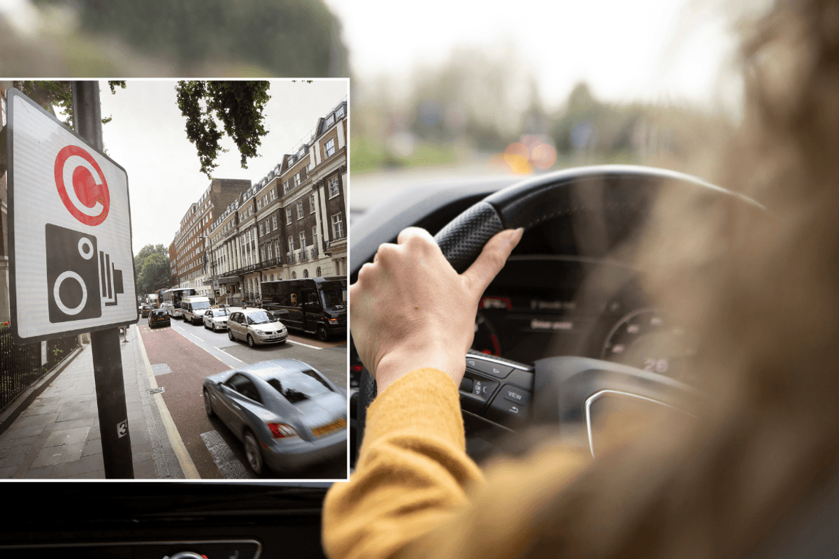 Congestion charge sign and driver in car