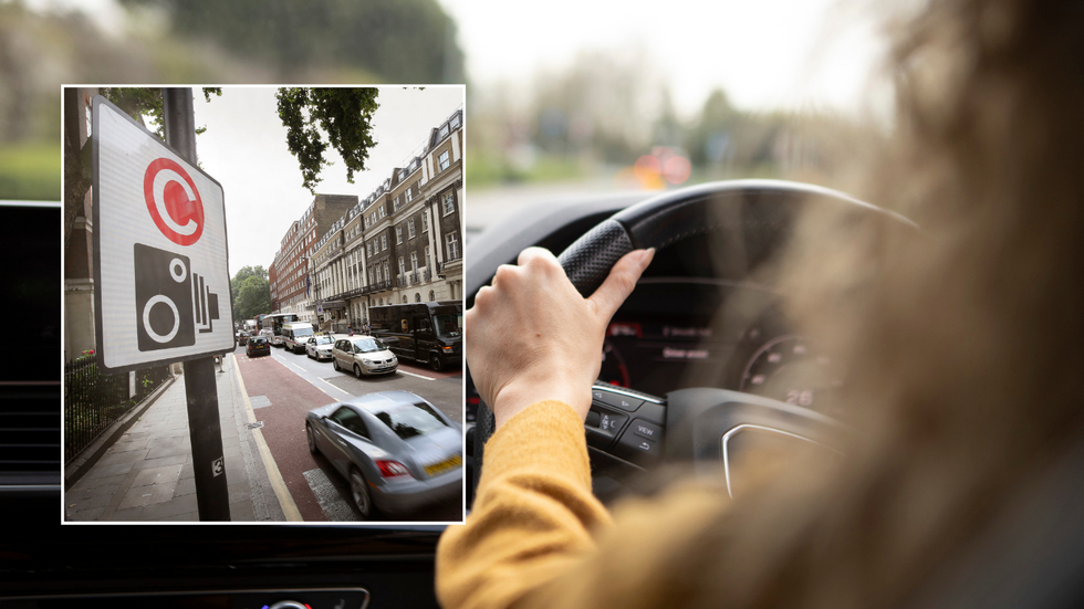 Congestion charge sign and driver in car