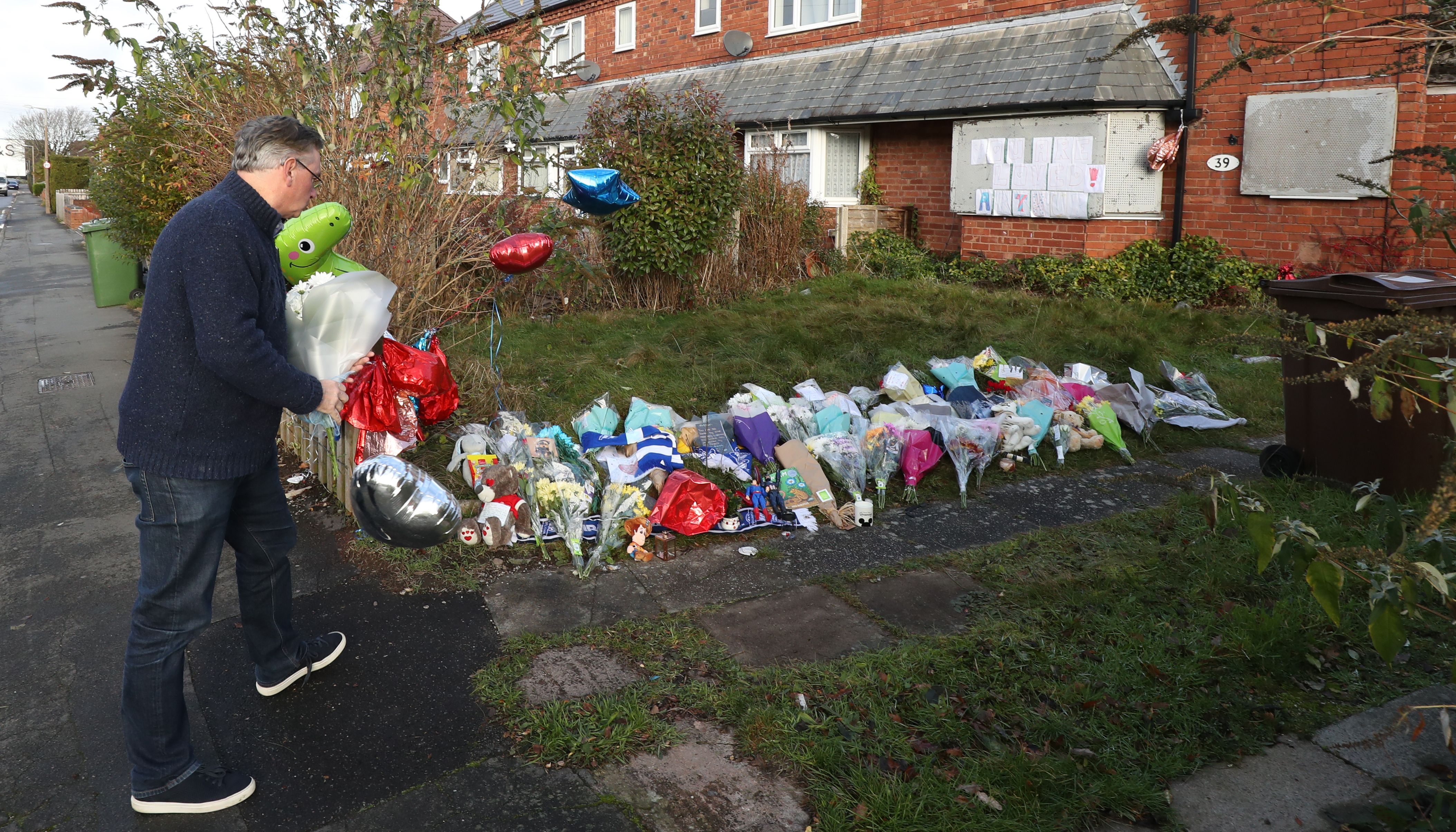 Conservative MP for Solihull Julian Knight leaves flowers outside the home of Arthur Labinjo-Hughes in Solihull, West Midlands. Emma Tustin was jailed for life with a minimum term of 29 years at Coventry Crown Court on Friday for cruelly starving, poisoning and then murdering her six-year-old stepson Arthur Labinjo-Hughes. Picture date: Saturday December 4, 2021.