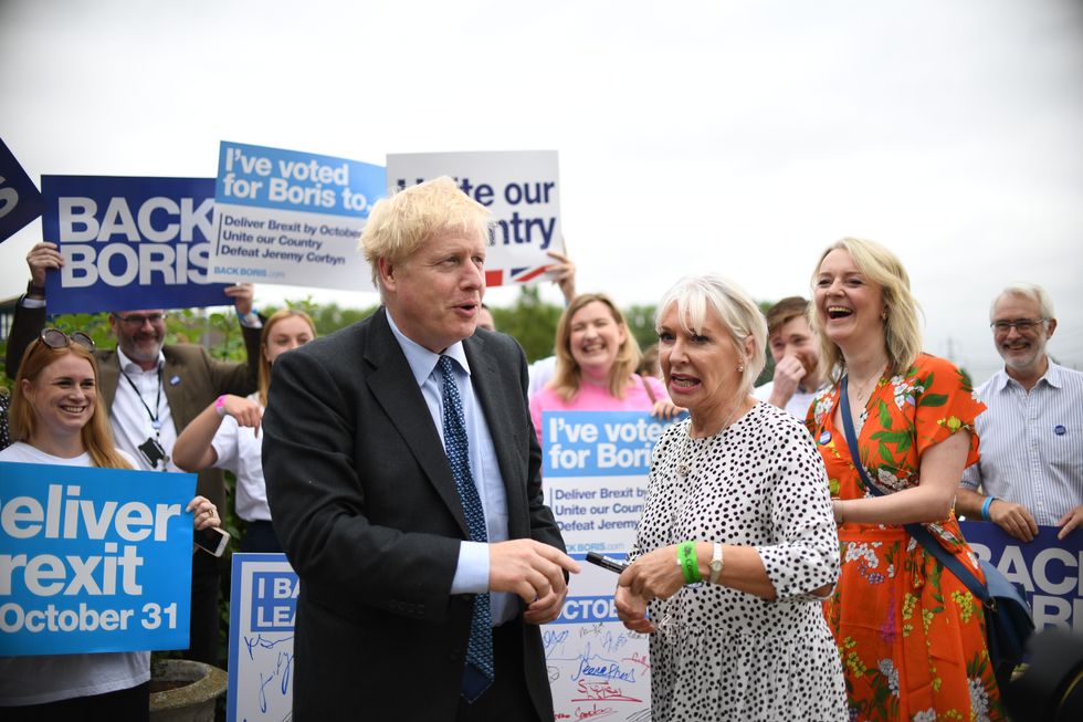 Conservative Party leadership candidate Boris Johnson with Nadine Dorries (centre)