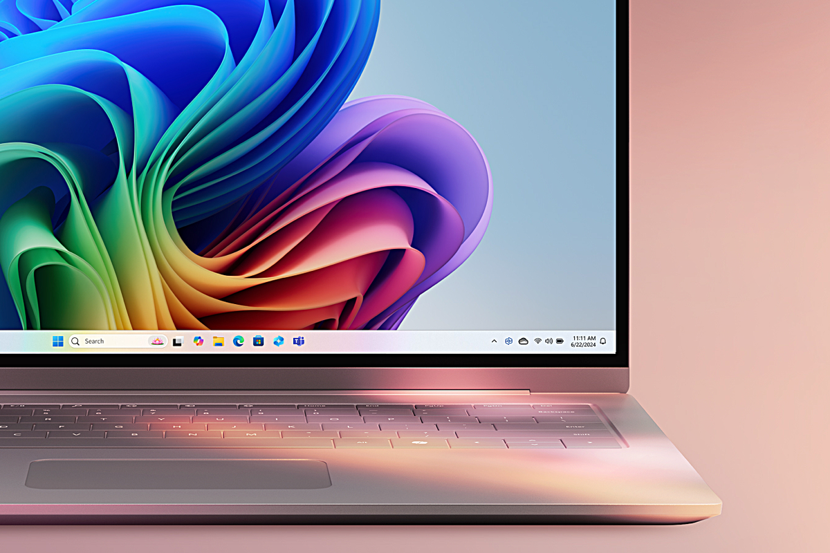 copilot plus pc pictured with a colourful background and windows 11 wallpaper