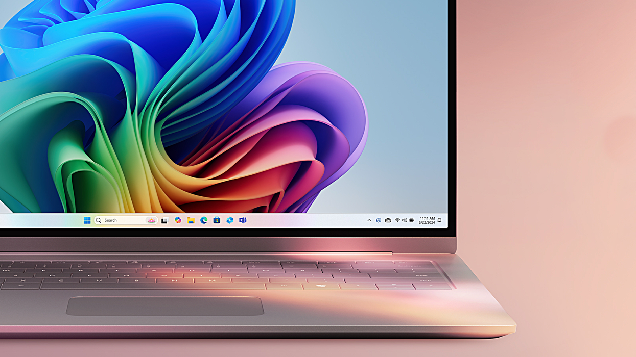 copilot plus pc pictured with a colourful background and windows 11 wallpaper