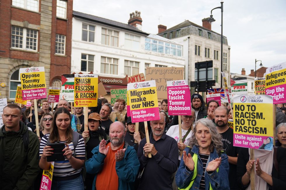 Counter protesters ahead of an anti-immigration protest outside the Refugee and Migrant centre in Birmingham