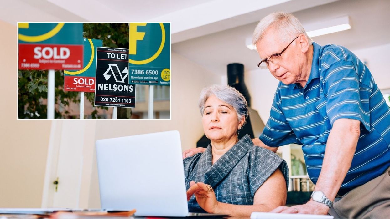 Couple at laptop, house sold