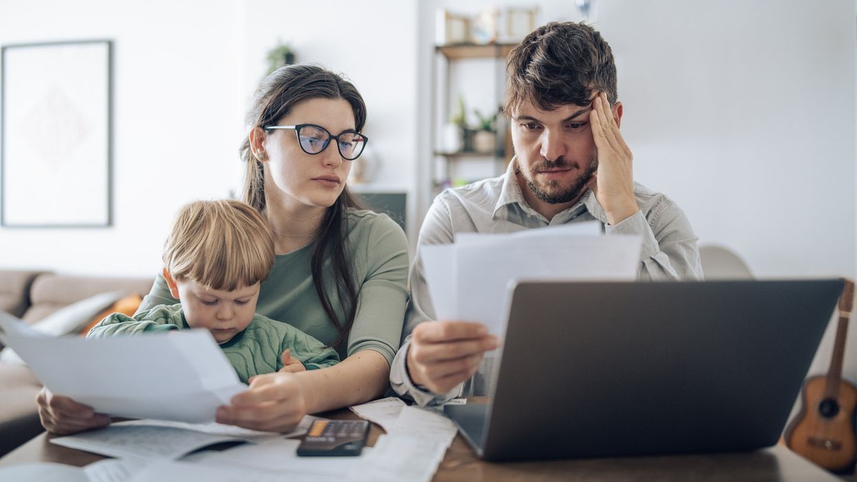 Couple at laptop with kid