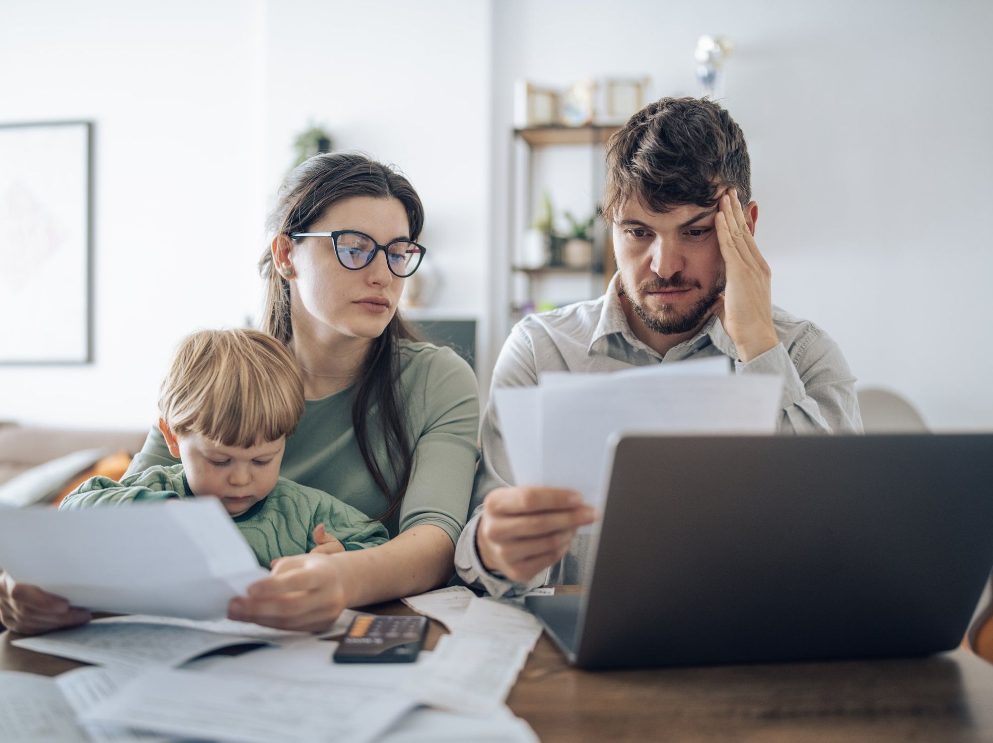 Couple at laptop with kid