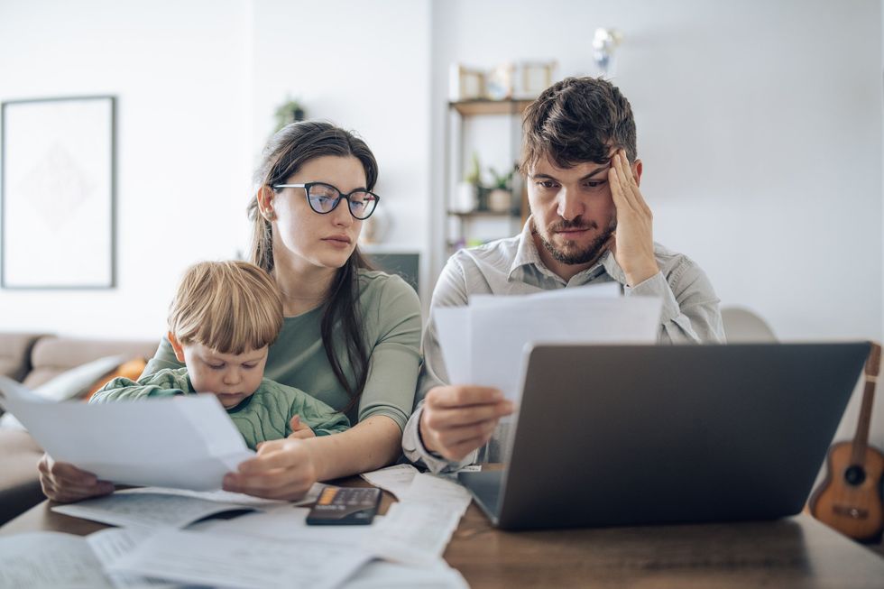 Couple at laptop with kid