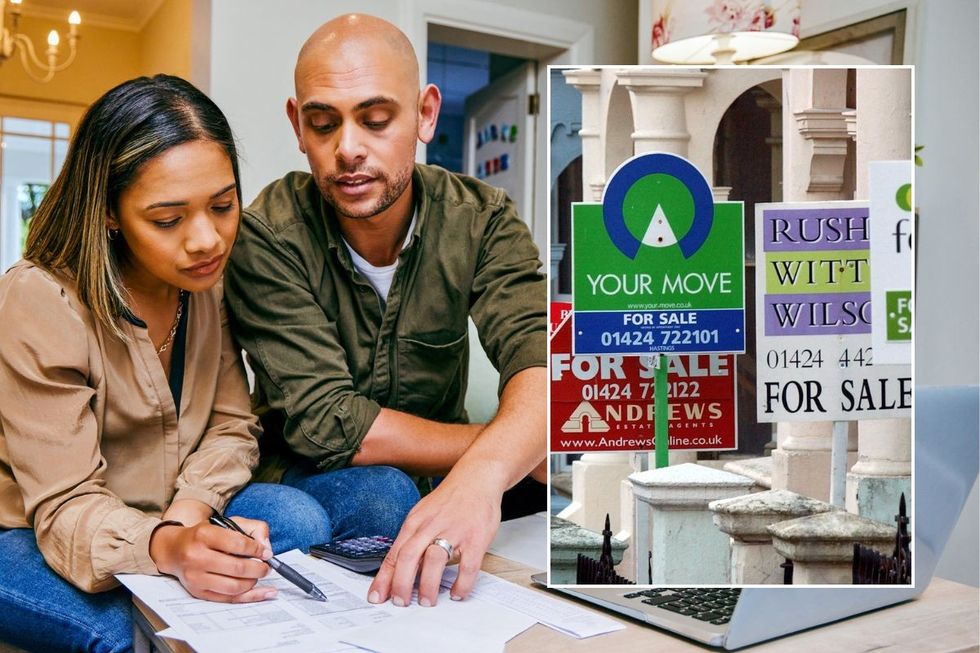 Couple doing paperwork / For sale signs outsisde property