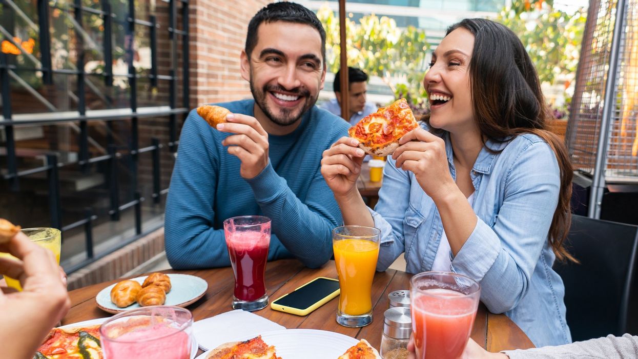 Couple eating pizza