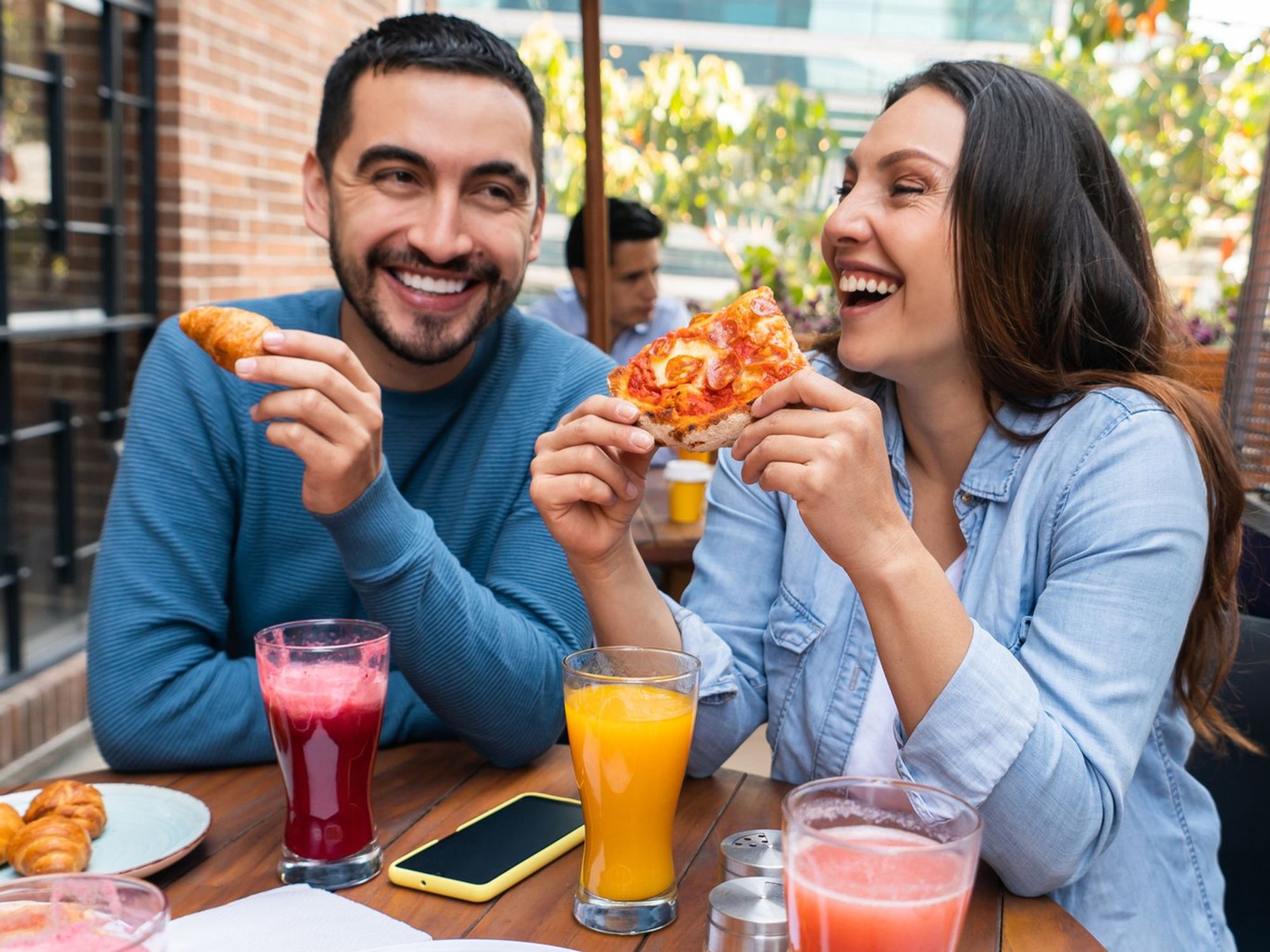 Couple eating pizza