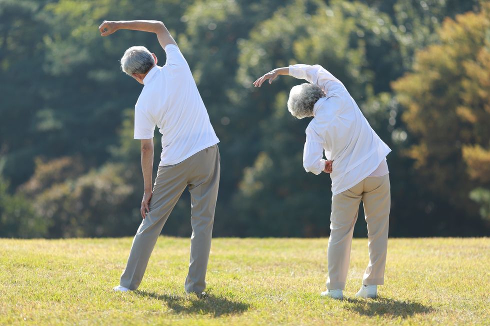 Couple exercising in park