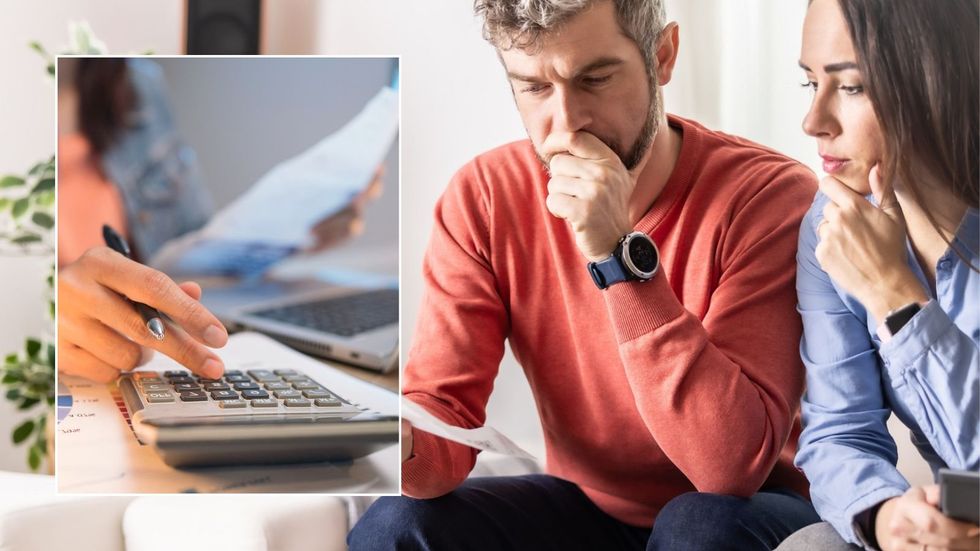 Couple going over finances and calculator