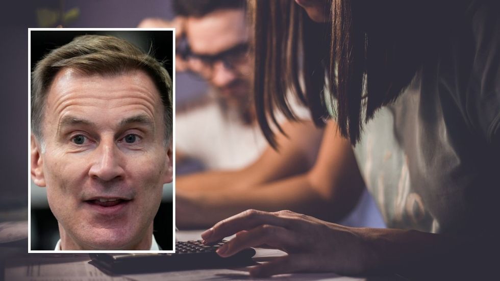 Couple going over finances and Jeremy Hunt
