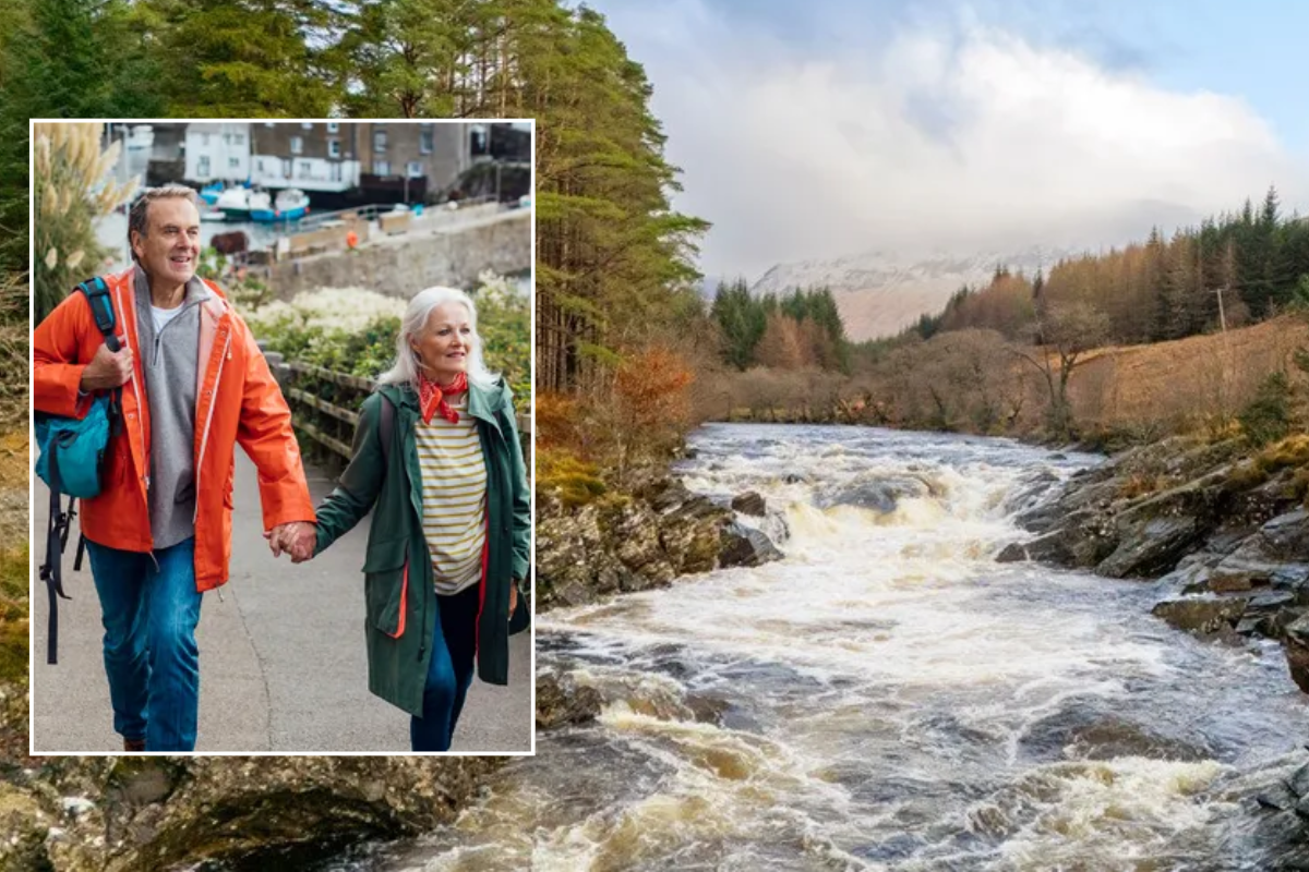 couple holding hands on UK break / Easan Dubha Waterfall in Glen Orchy Argyll and Bute, Scotland