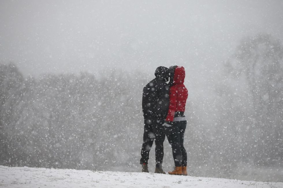 Couple kissing snow