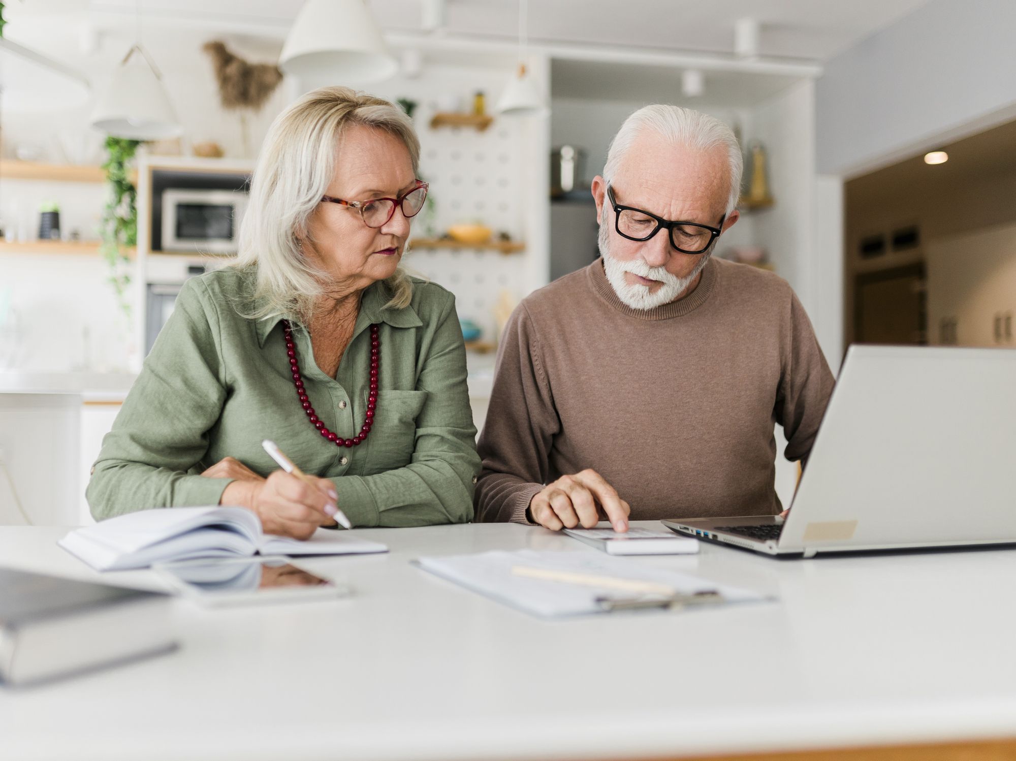 Couple look at laptop