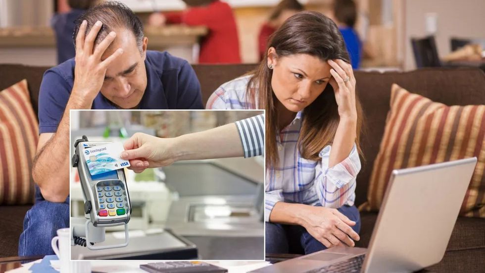 Couple look stressed at contactless bill