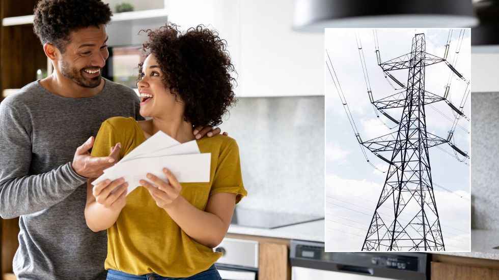 Couple looking at bills and pylon