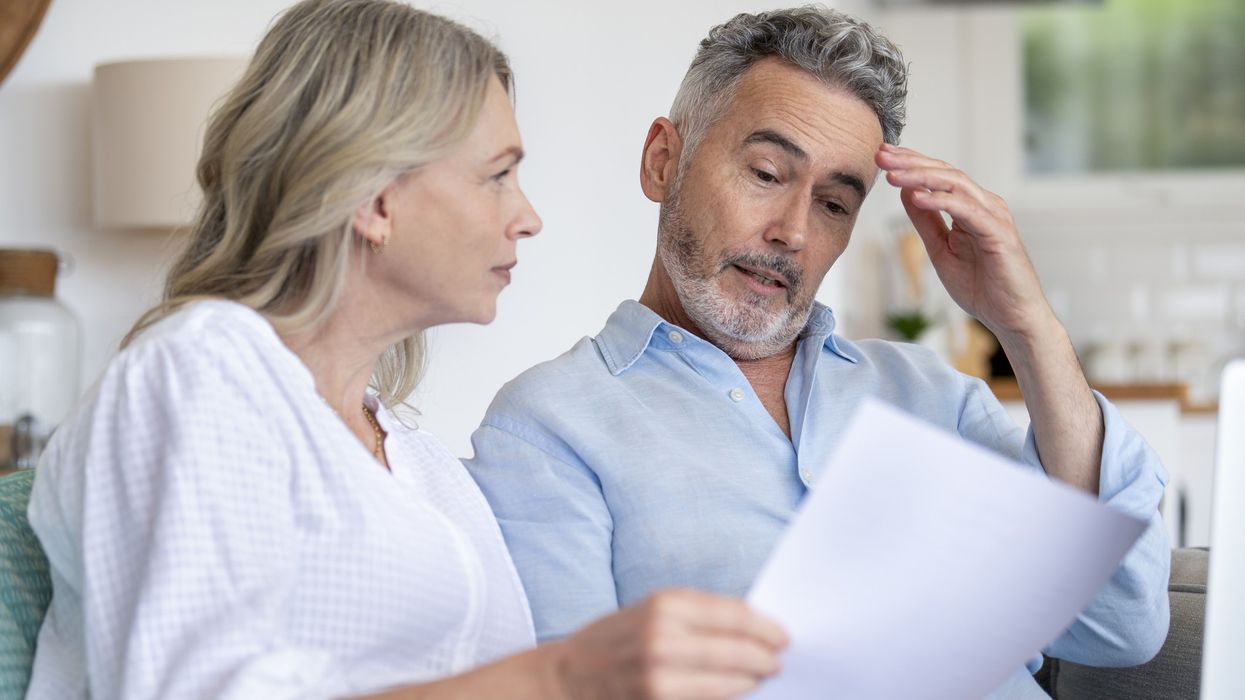 Couple looking at documents confused