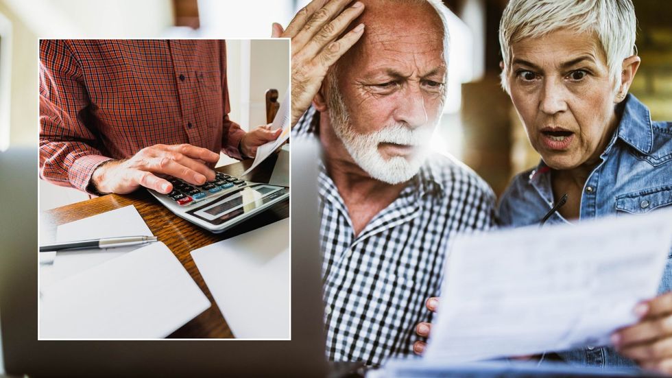 Couple looking at finances and calculator