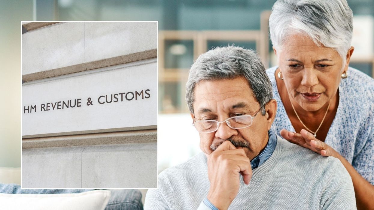 Couple looking at laptop and HMRC sign