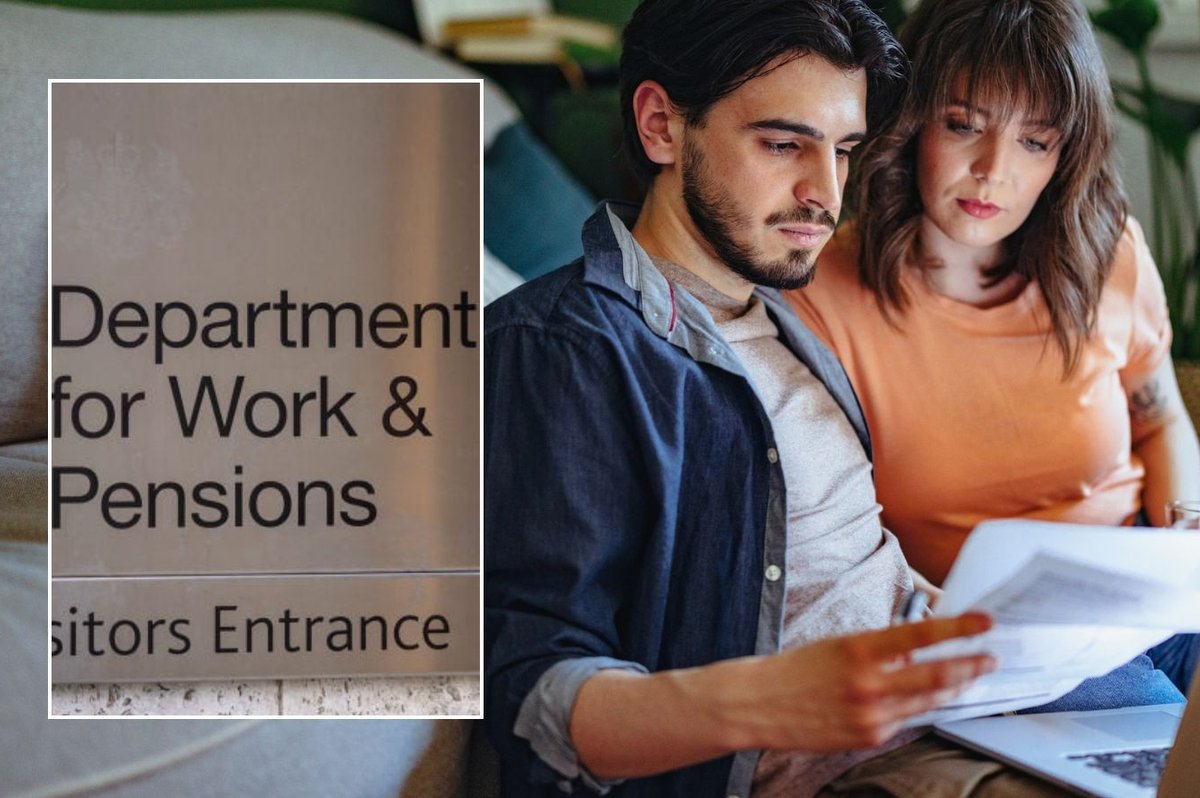 Couple looking at letter and DWP sign