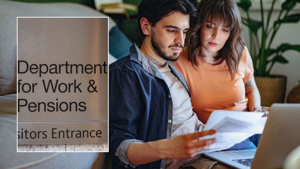 Couple looking at letter and DWP sign