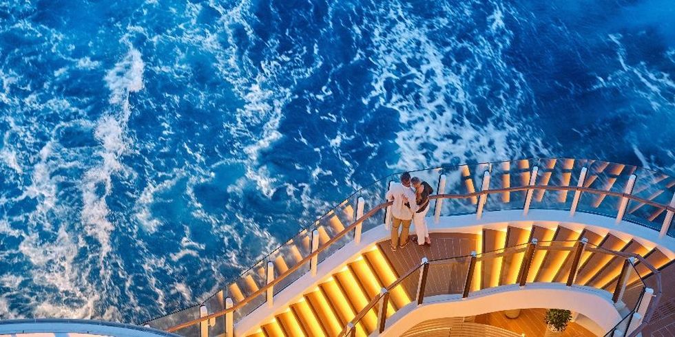 Couple looking at water on Silversea cruise ship