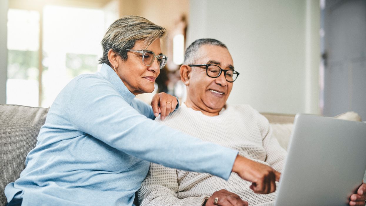 Couple looks at laptop