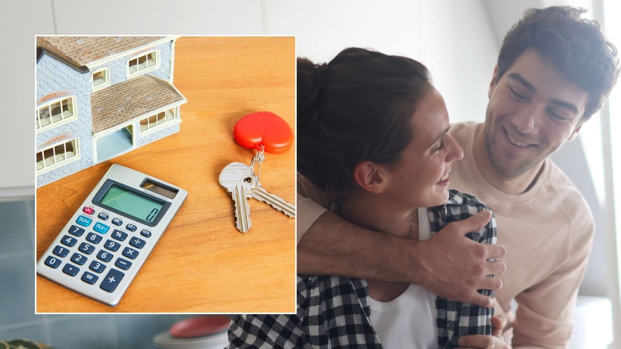 Couple moving into house, calculator and keys