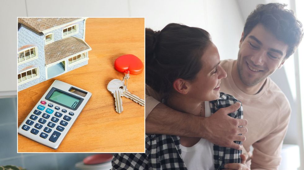 Couple moving into house, calculator and keys