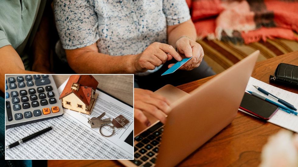 Couple paying and mortgage documents