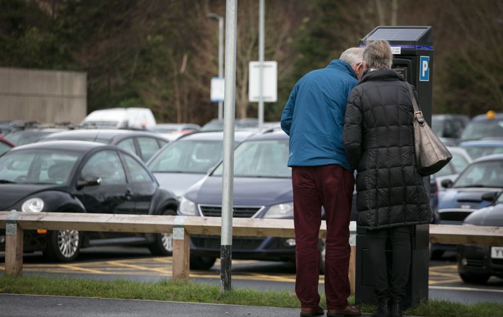 Couple paying for parking
