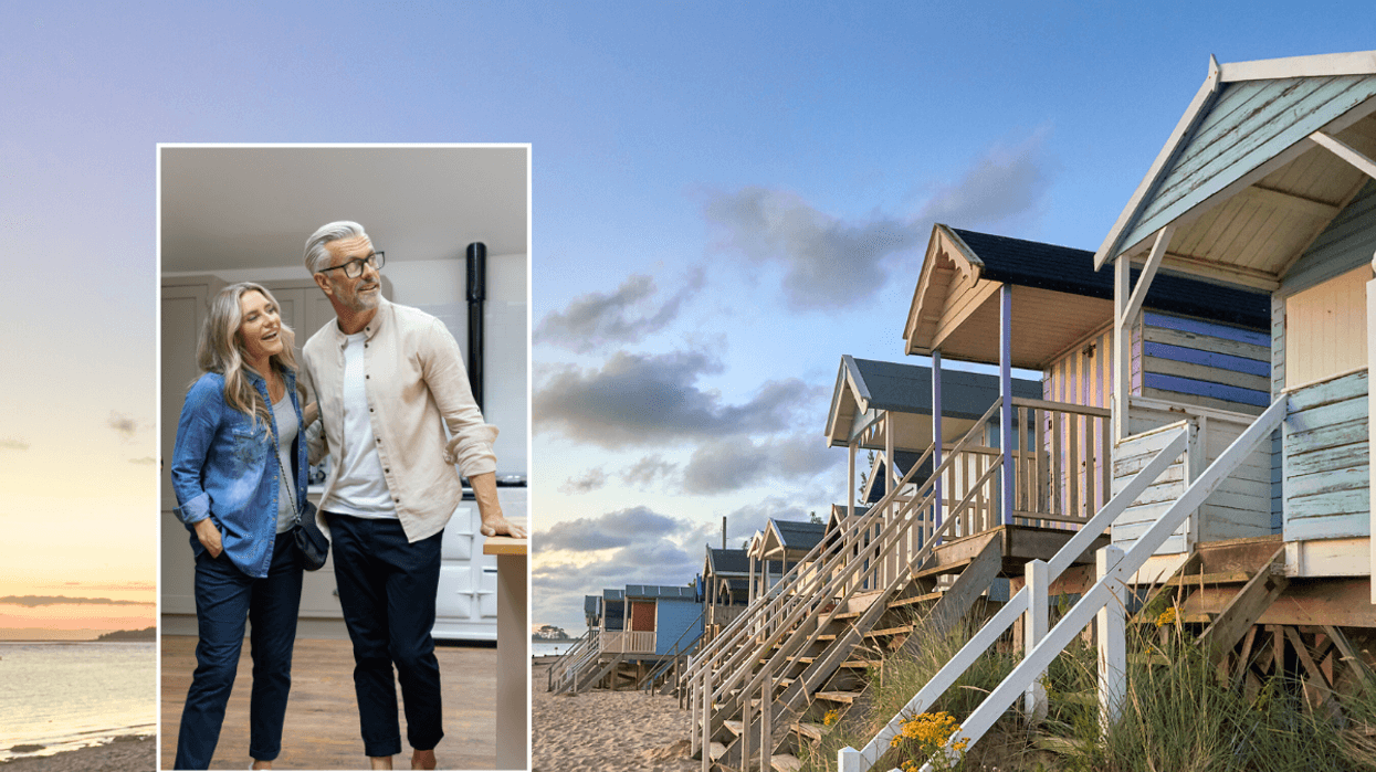 Couple viewing home / North Norfolk beach