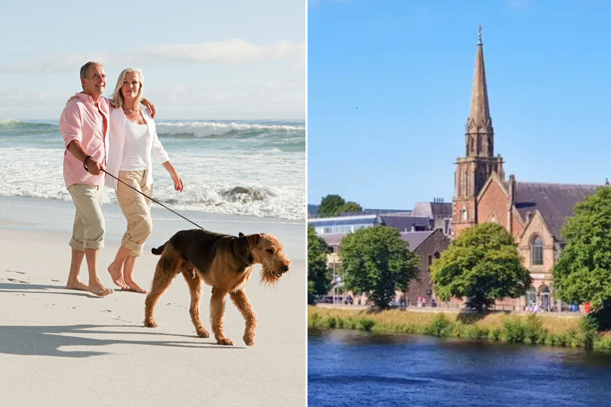 couple walking a dog on beach / Inverness