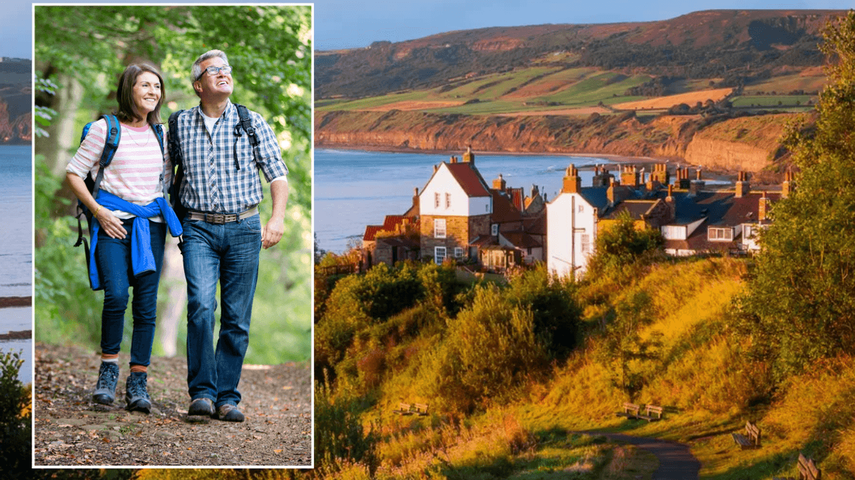Couple walking in UK / Robin Hood's Bay, Yorkshire
