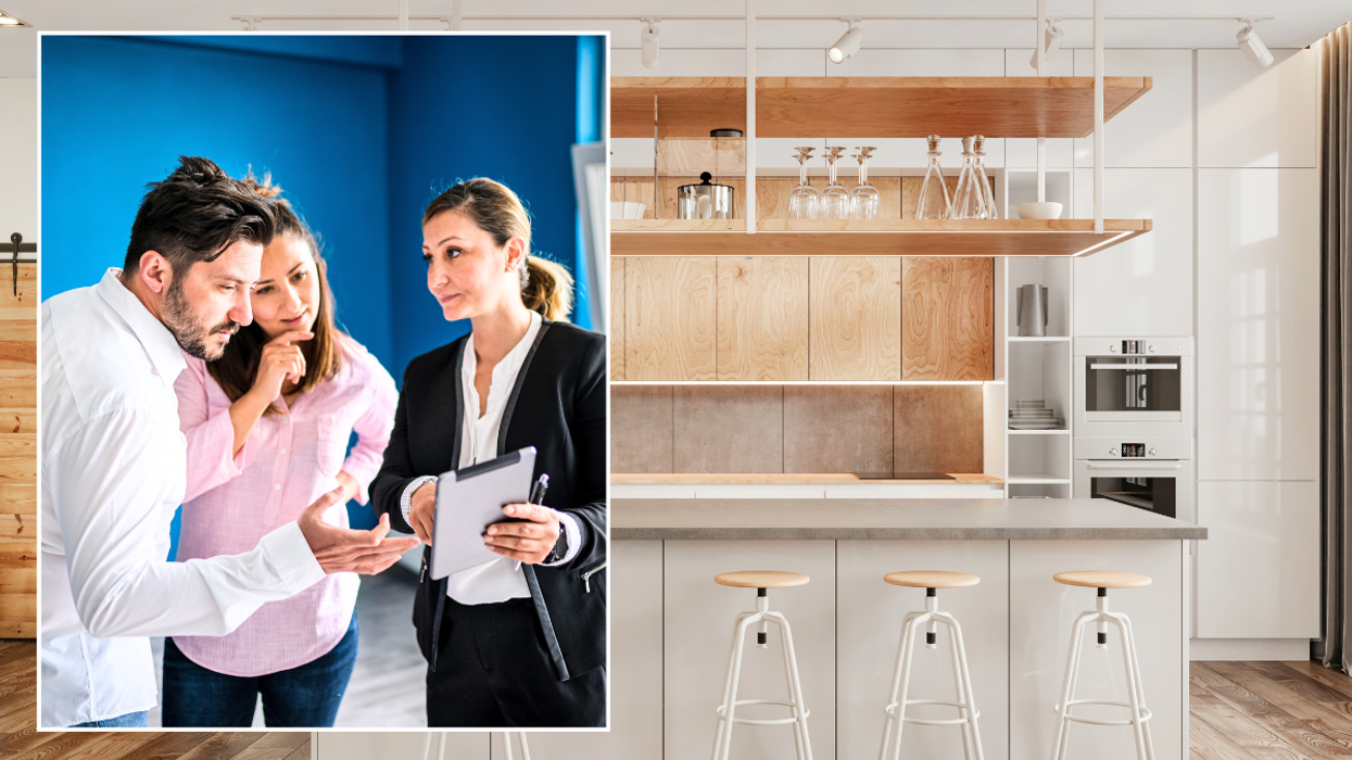 Couple with estate agent / modern kitchen