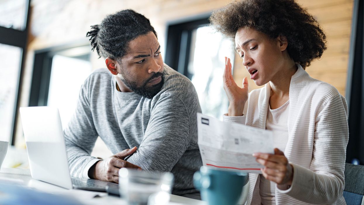 Couple worried at laptop