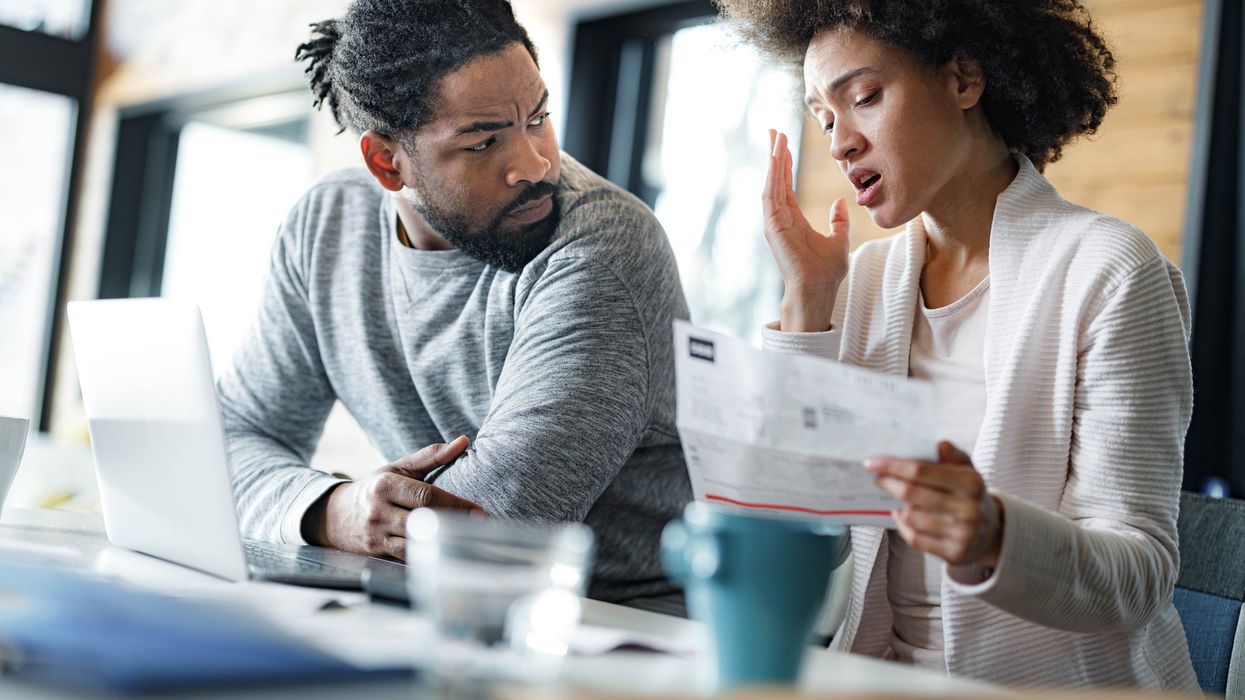Couple worried at laptop