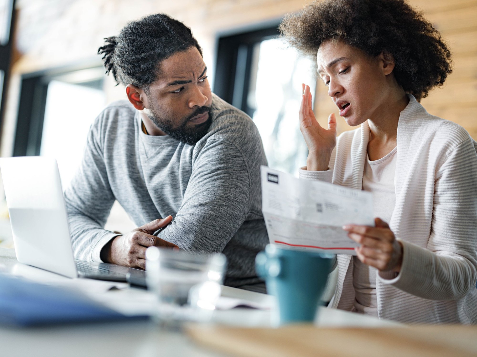Couple worried at laptop