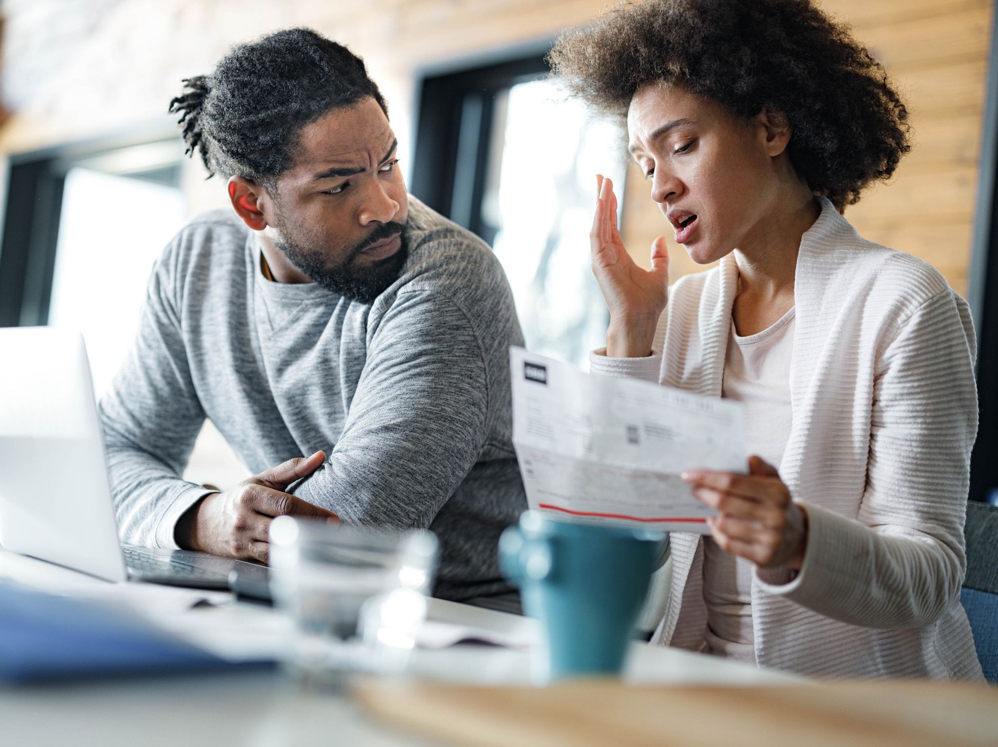 Couple worried at laptop