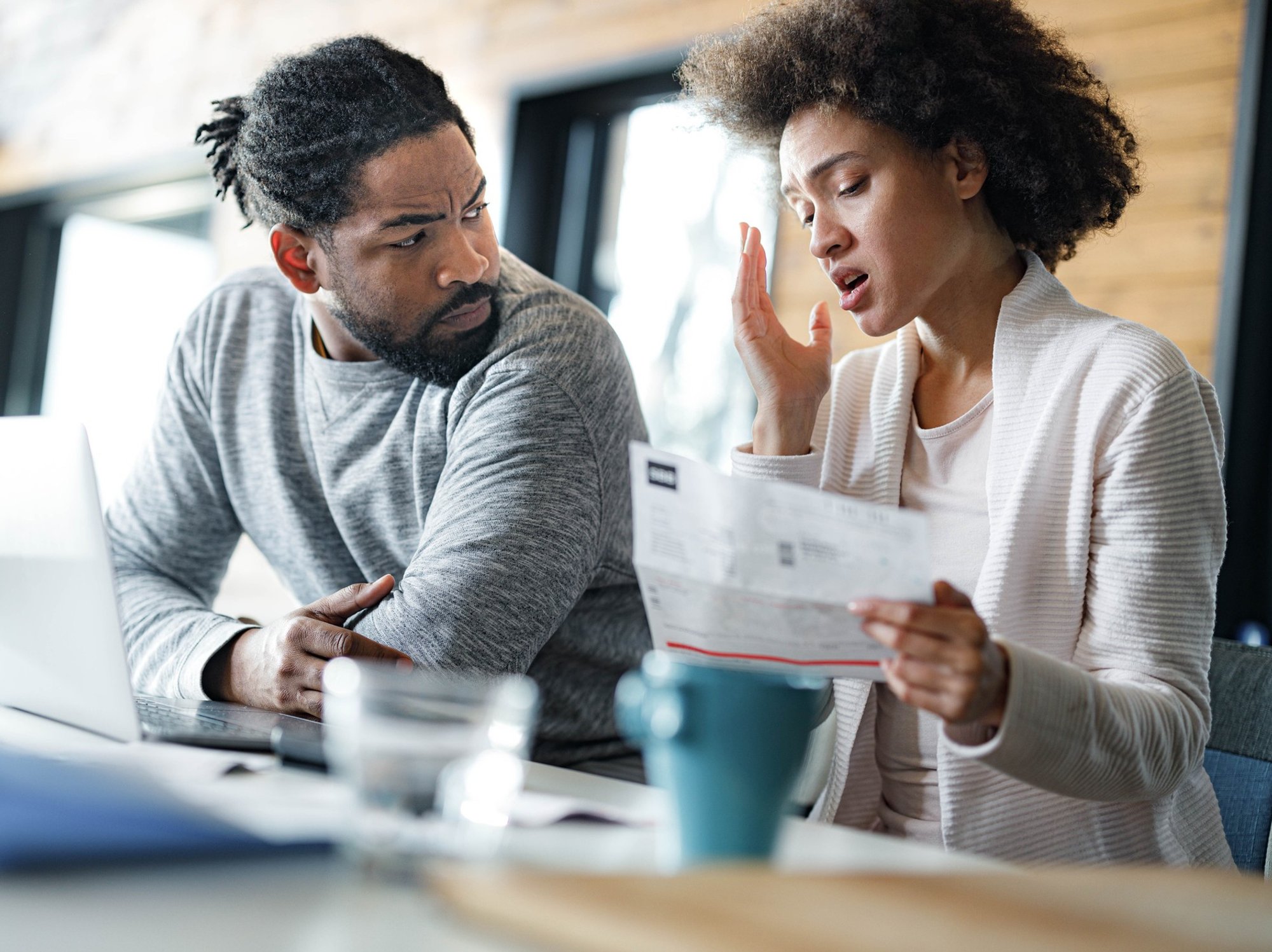 Couple worried at laptop