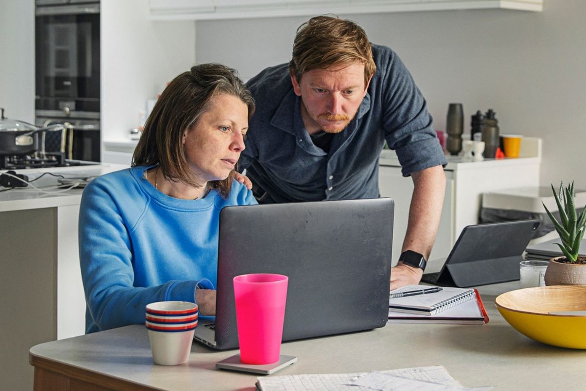 Couple worried at laptop