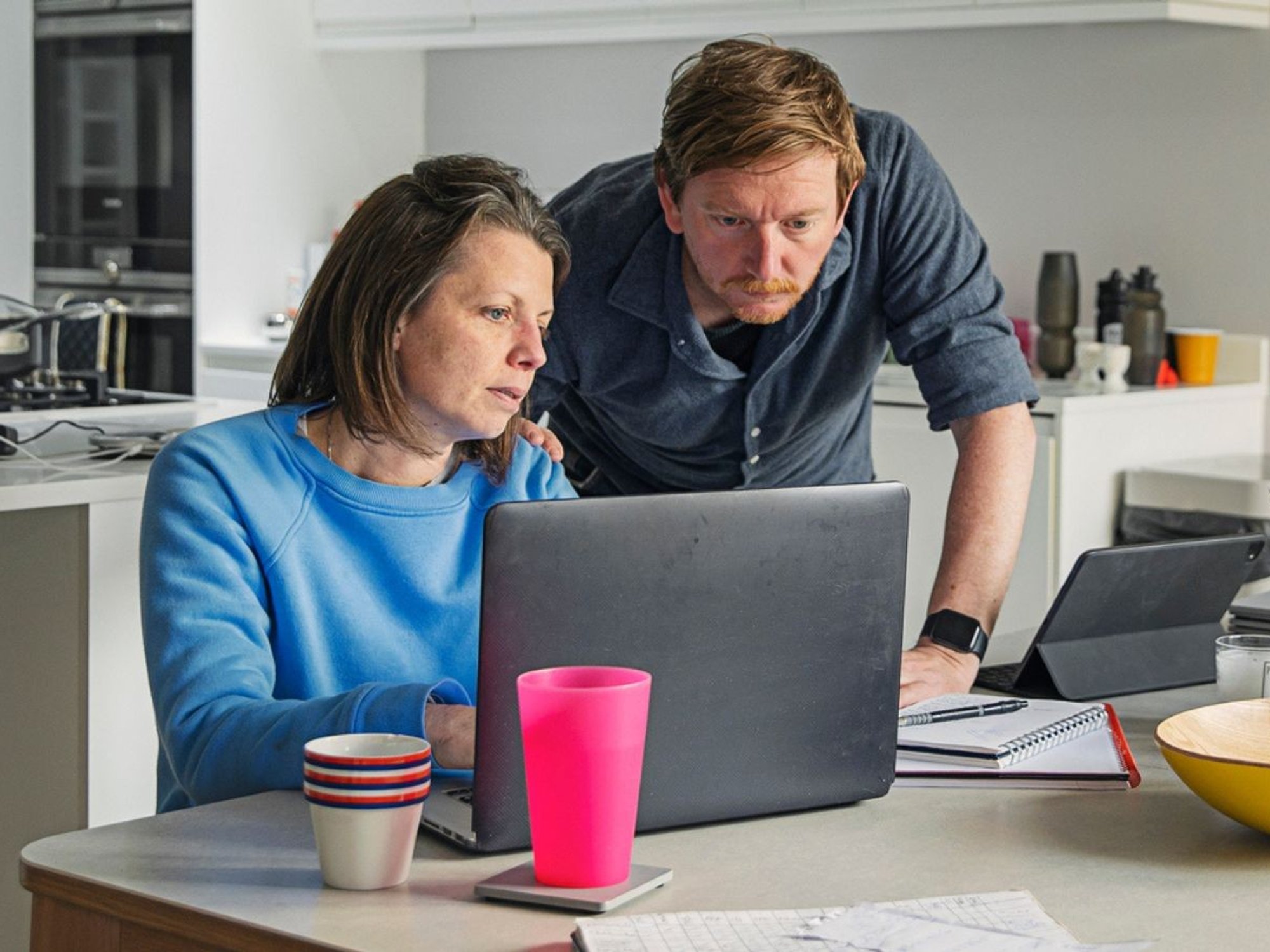 Couple worried at laptop