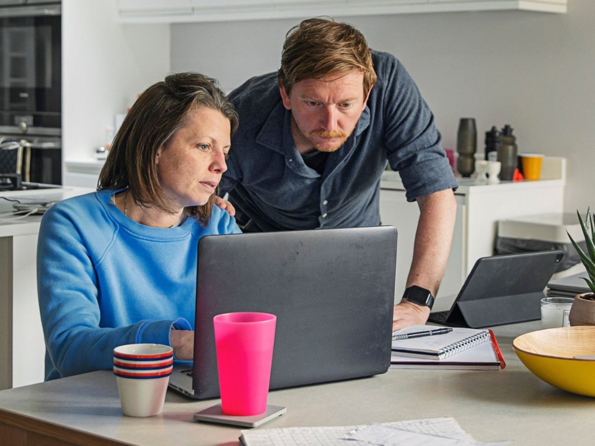 Couple worried at laptop