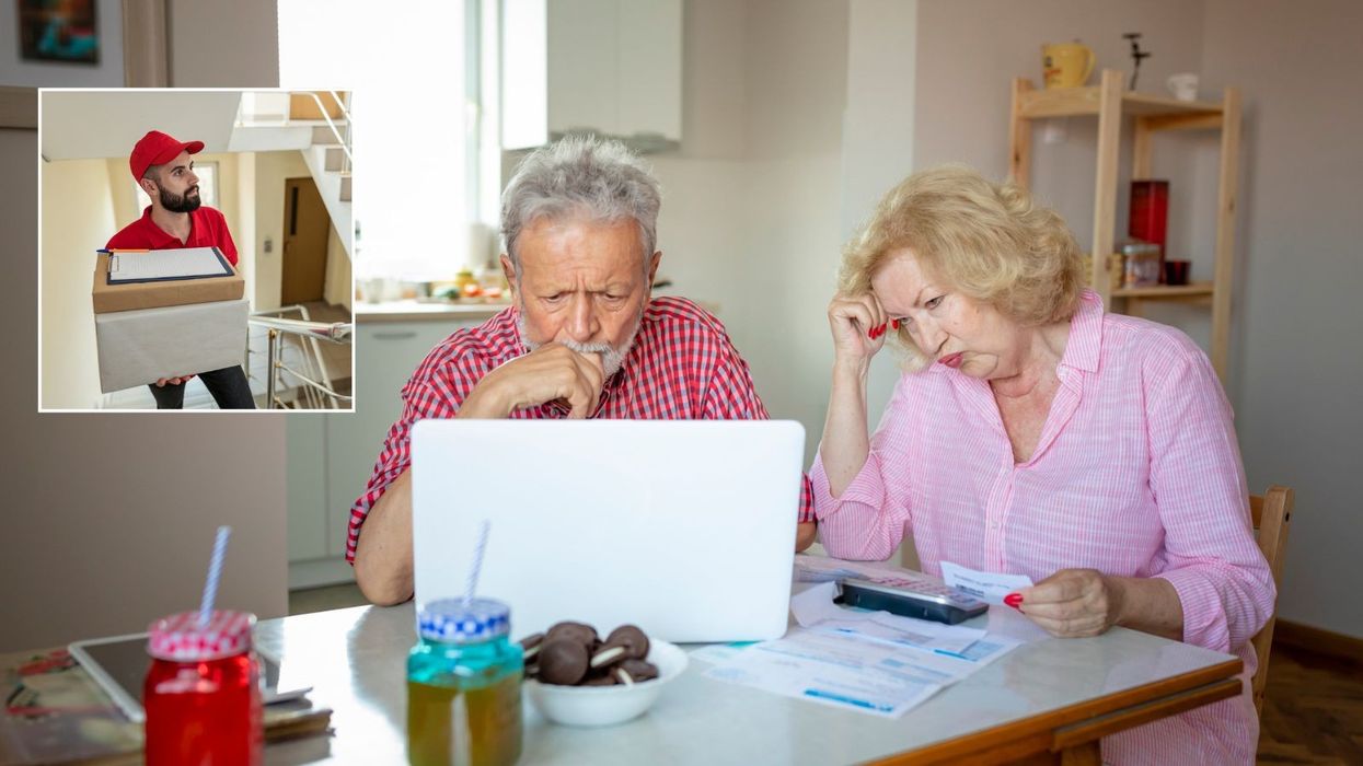 Couple worried looking at bills