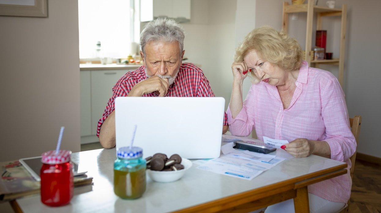 Couple worried looking at bills