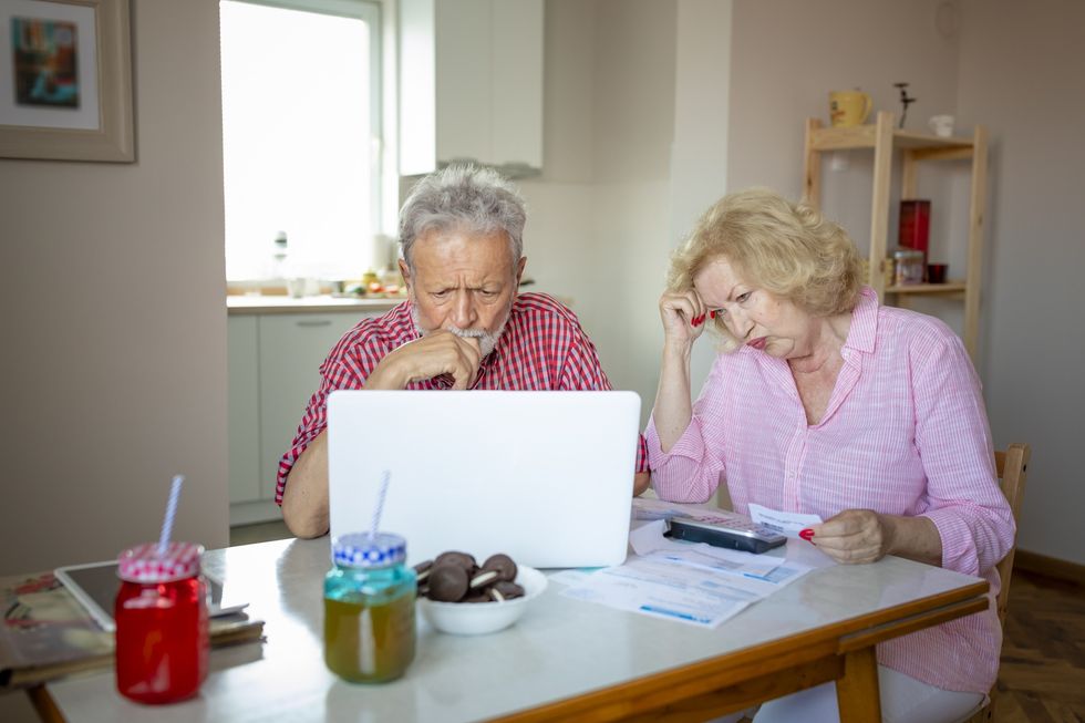 Couple worried looking at bills
